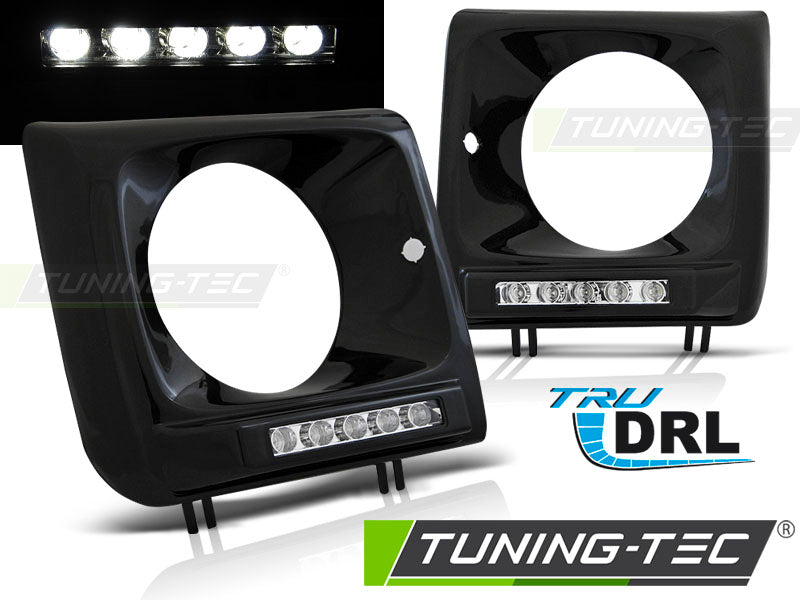 Tuning-Tec LED Tagfahrlicht Scheinwerferrahmen für Mercedes Benz G-Klasse W463/W461 01-12 schwarz (hochglanz)