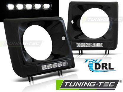 Tuning-Tec LED Tagfahrlicht Scheinwerferrahmen für Mercedes Benz G-Klasse W463/W461 01-12 schwarz (hochglanz)