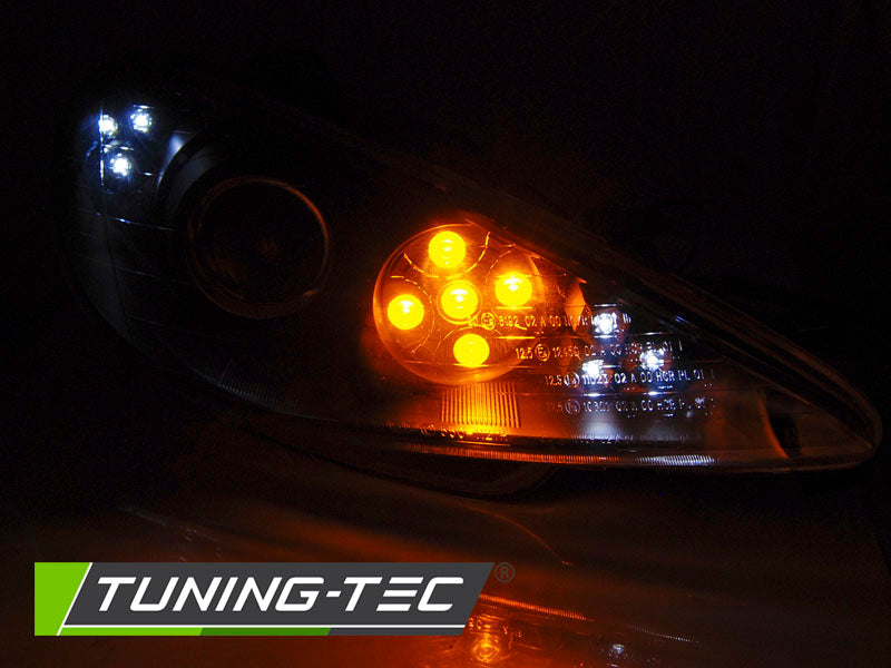 Tuning-Tec LED Angel Eyes Scheinwerfer für Peugeot 206 02-14 schwarz mit LED Blinker