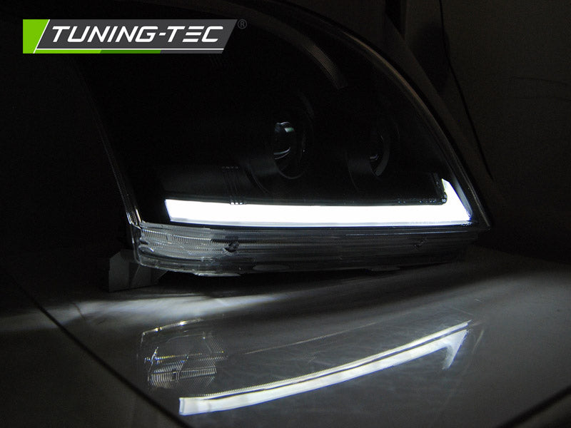 Tuning-Tec LED Tagfahrlicht Scheinwerfer für Toyota Land Cruiser 120 03-09 schwarz mit dynamischem LED Blinker