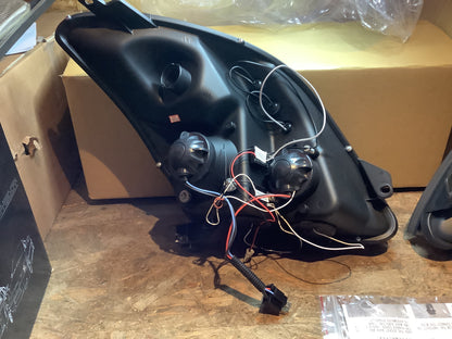 Tuning-Tec LED Angel Eyes Scheinwerfer für Suzuki Swift 05-10 schwarz