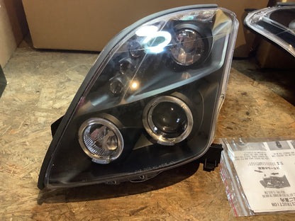 Tuning-Tec LED Angel Eyes Scheinwerfer für Suzuki Swift 05-10 schwarz