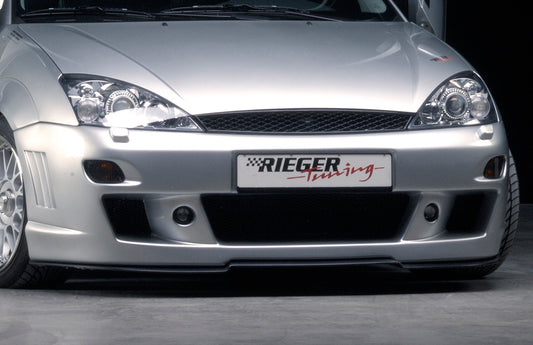 Ford Focus 1 Rieger Spoilerstoßstange -> bis Modell 10/2001 mit Aussparung für Blinkleuchten, mit seitlichen Rippen, ABS, für Fzg. mit Scheinwerferreinigungsanlage, 
inkl. Alugitter, Montagezubehör, ABE