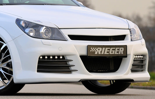 Opel Astra H Rieger Spoilerstoßstange mit kleiner Aussparung für SWRA mit Aussparung für Tagfahrleuchten, ABS, für Fzg. mit Scheinwerferreinigungsanlage, OPC und ohne OPC, 
inkl. Montagezubehör, Alugitter, Lüftungsschacht, Lufteinlassblende, ABE