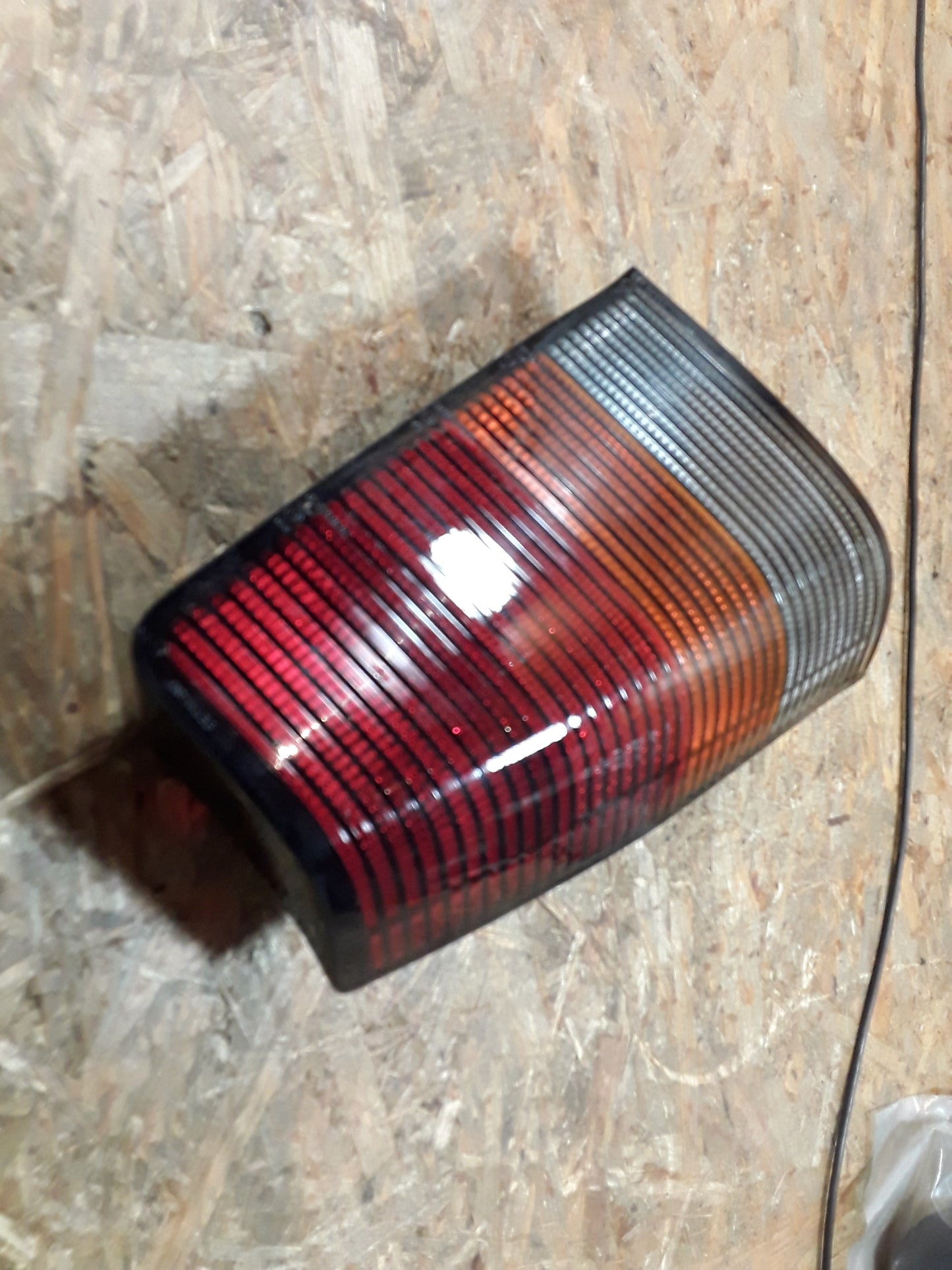 Kadett E Rückleuchte links dunkel original GM Opel NEU