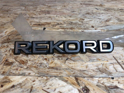 Original GM Opel Rekord Emblem steckend *NEU*